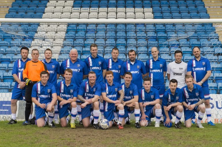 Players competing in the MEMS charity football match for Take Heart Mercy Mission.