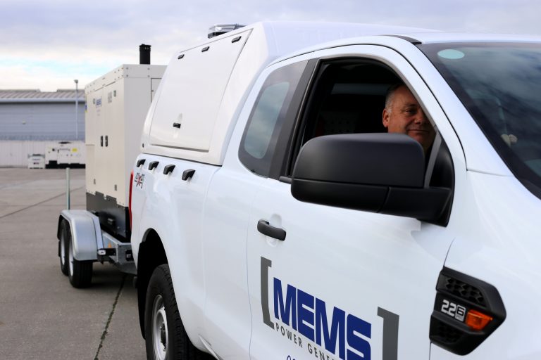 MEMS Logistics transport fleet delivering generator rental equipment to a challenging site location.