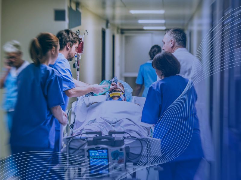 Nurses monitoring patients during a hospital power outage, supported by MEMS backup power systems.