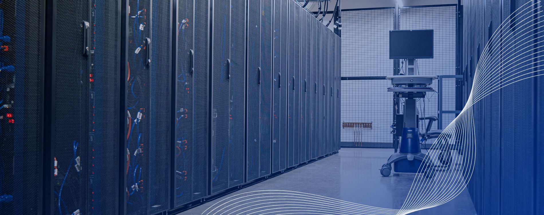 A modern data centre corridor with rows of black server racks and cabling, illustrating the critical infrastructure that MEMS data centre power solutions keep running during outages.