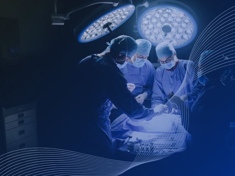 Surgeons working in a well-lit operating theatre powered by MEMS temporary generators during a hospital power failure.