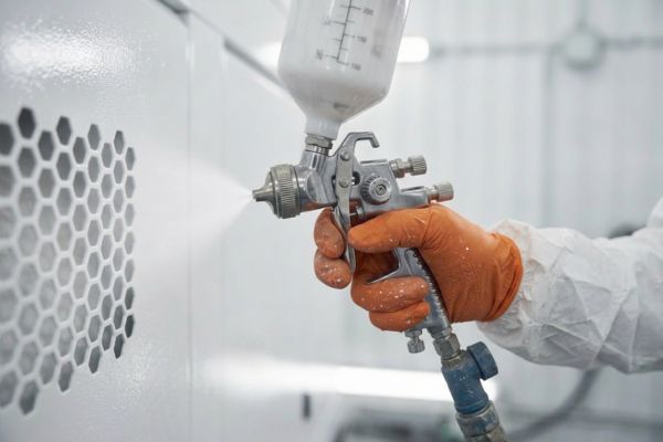 Paint Sprayer and Refurb Engineer working on generator refurbishment at MEMS in Gillingham, Kent.